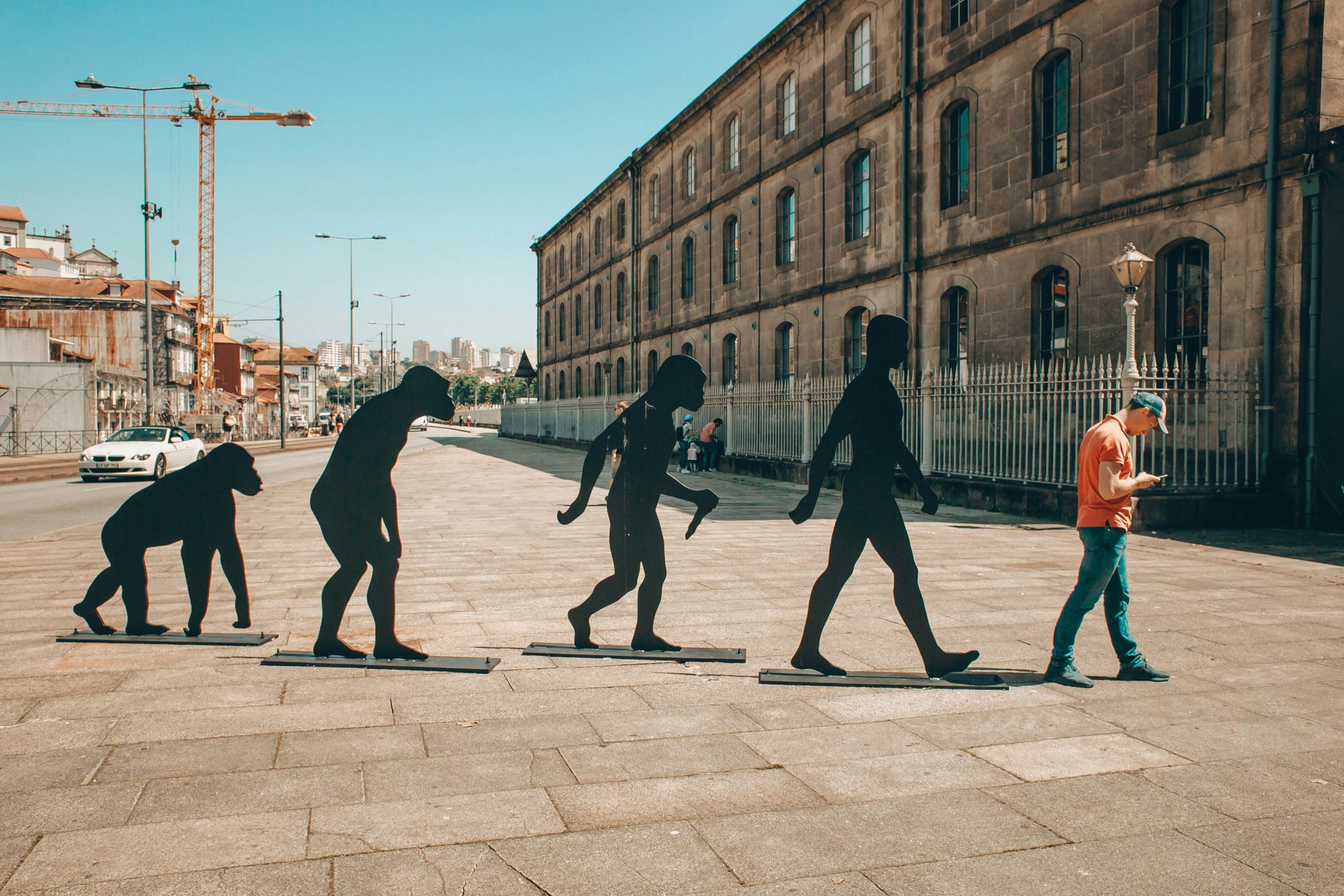 statues of evolution as an art installation in a city to represent the evolution of escape rooms